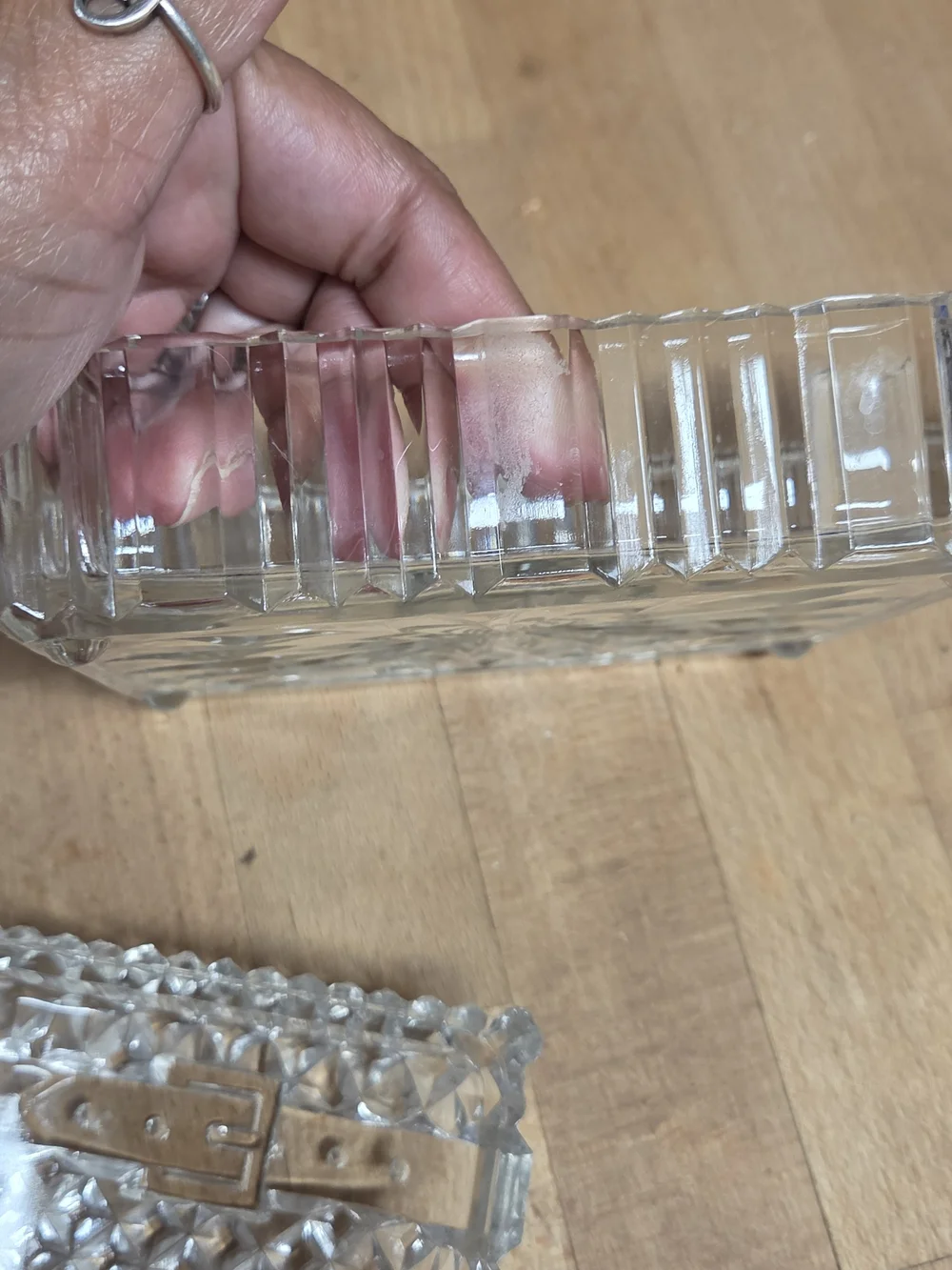 Vintage clear pressed glass trinket box shaped like a miniature treasure chest